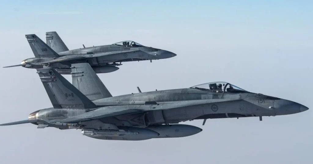 CF-18 fighter jets escorting an Air Canada flight at Montreal-Trudeau International Airport.